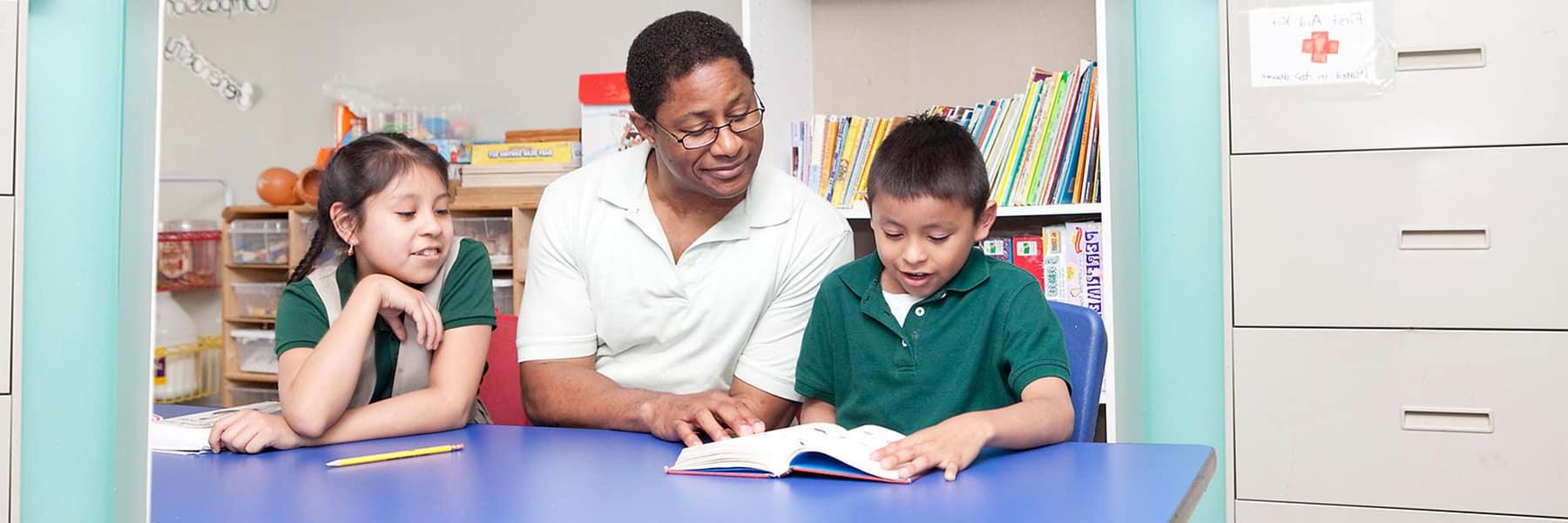 UMass Boston student tutors at Denny afterschool.